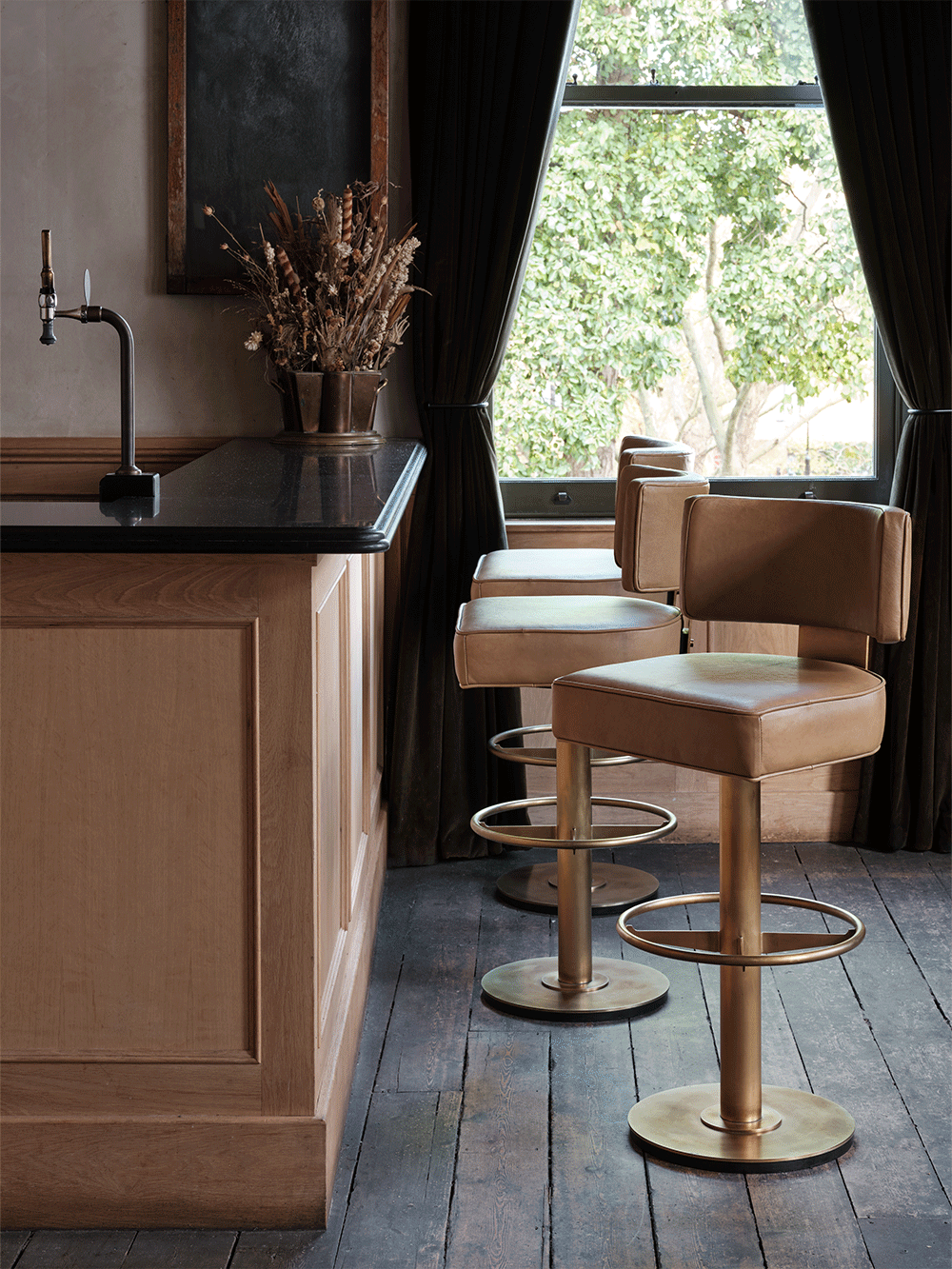Wooden bar counter and leather bar stools.