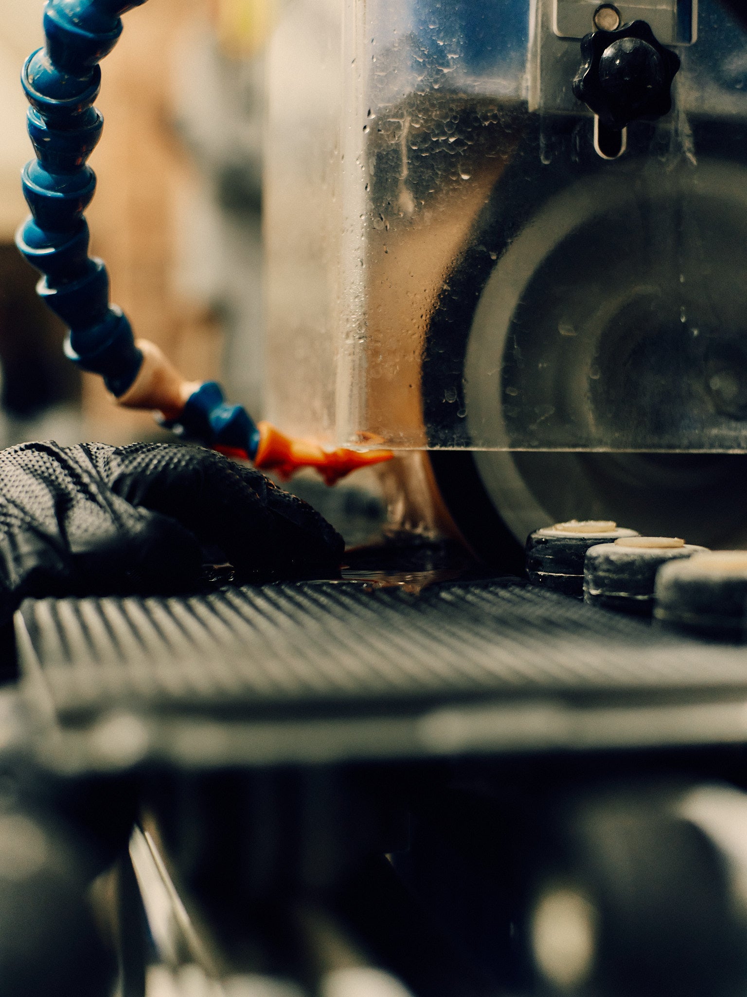 Close-up of a machine with a focus on the gear and surrounding components.
