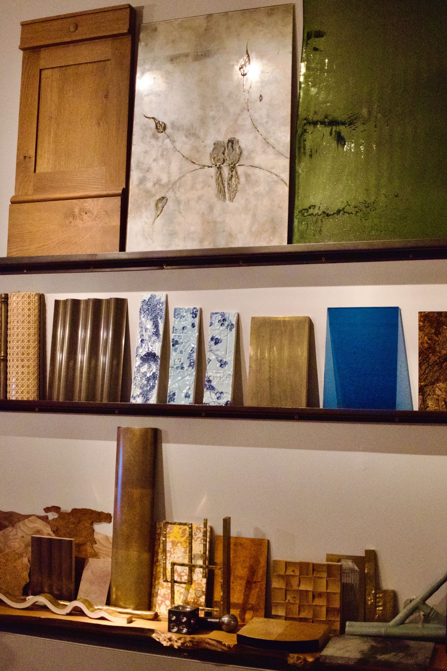 Shelf displaying various material samples.