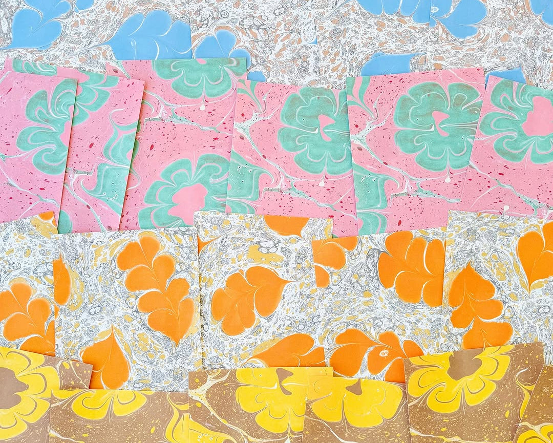 A close-up of a multicolour floral marbled patterned wallpaper.