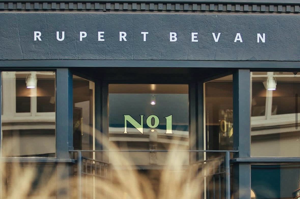 Building facade with 'Rupert Bevan' and 'No.1' signage.